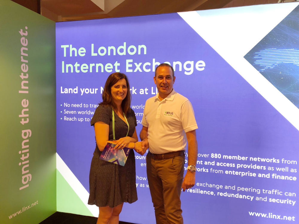 people shaking hands at the london internet exchange
